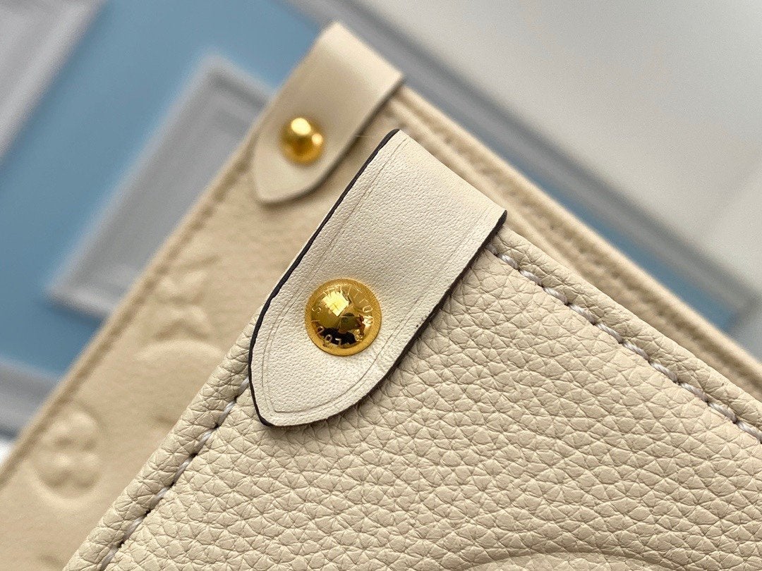 Onthego GM 41 Cream Monogram Empreinte Giant Canvas
