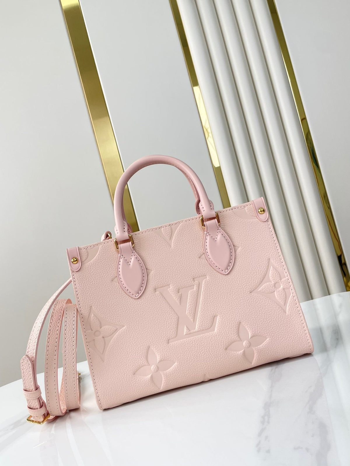 Onthego PM 25 in Opale Pink Monogram Empreinte Leather