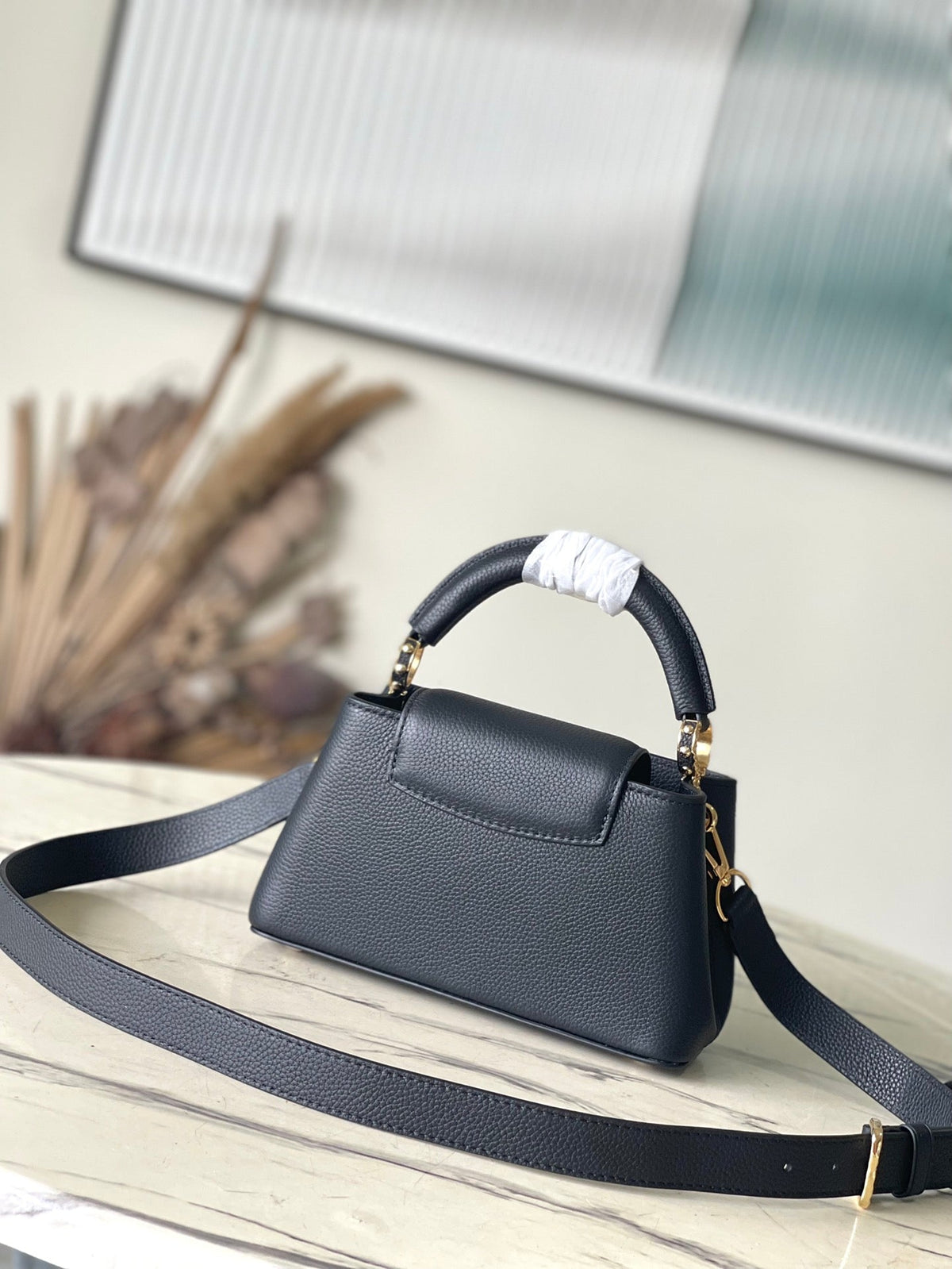 Capucines East-west Mini 22 in Black Calfskin Gold Hardware