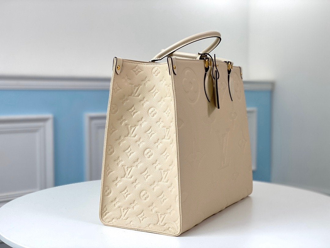 Onthego GM 41 Cream Monogram Empreinte Giant Canvas