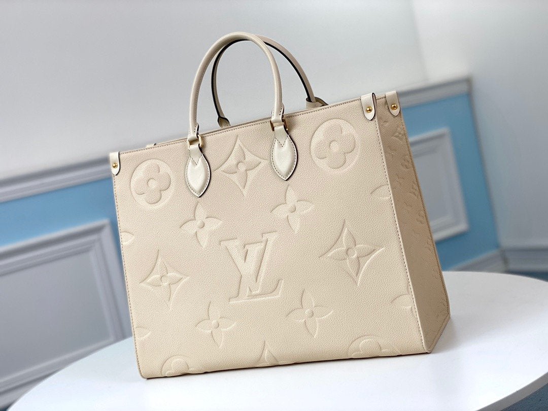 Onthego GM 41 Cream Monogram Empreinte Giant Canvas