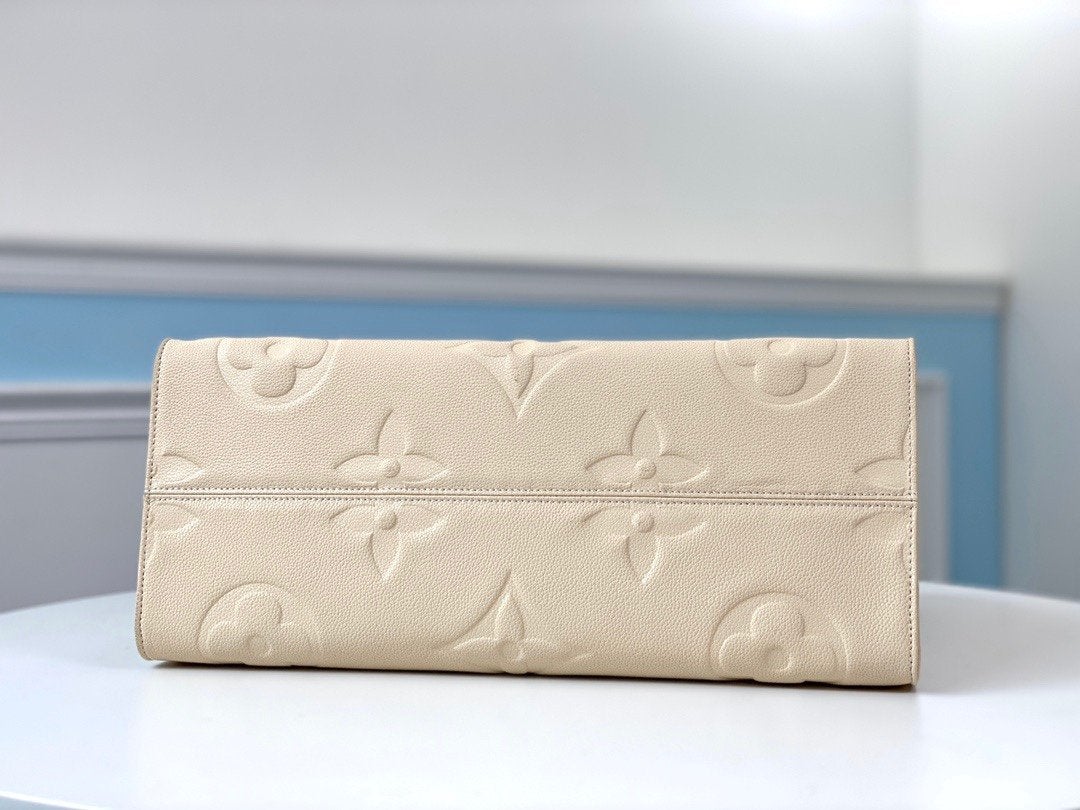 Onthego GM 41 Cream Monogram Empreinte Giant Canvas