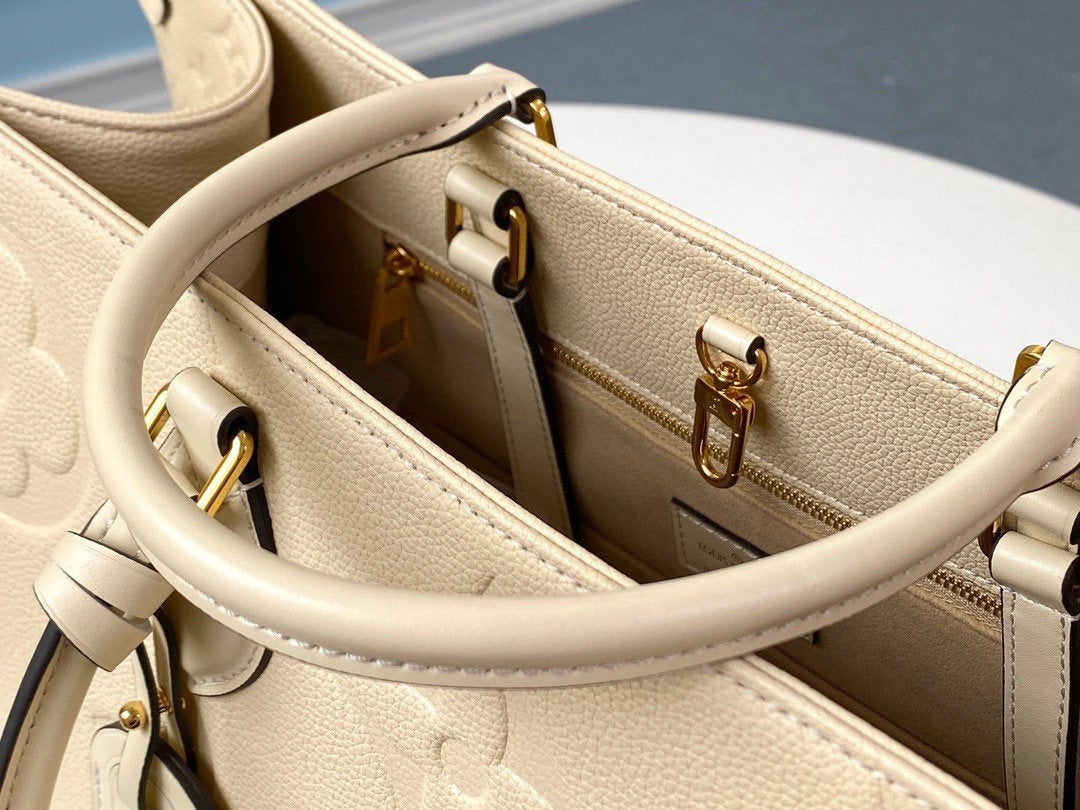 Onthego GM 41 Cream Monogram Empreinte Giant Canvas