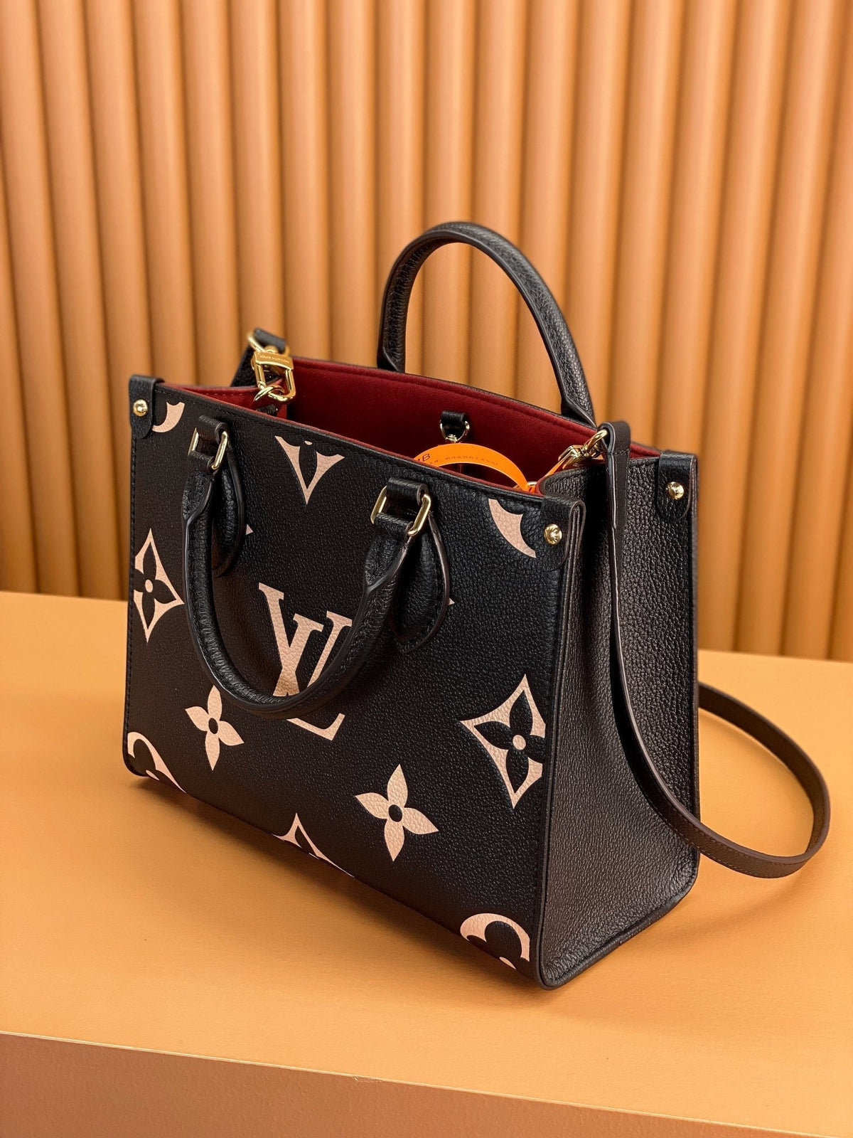 Onthego Tote 25 in Black and Cream Monogram Empreinte