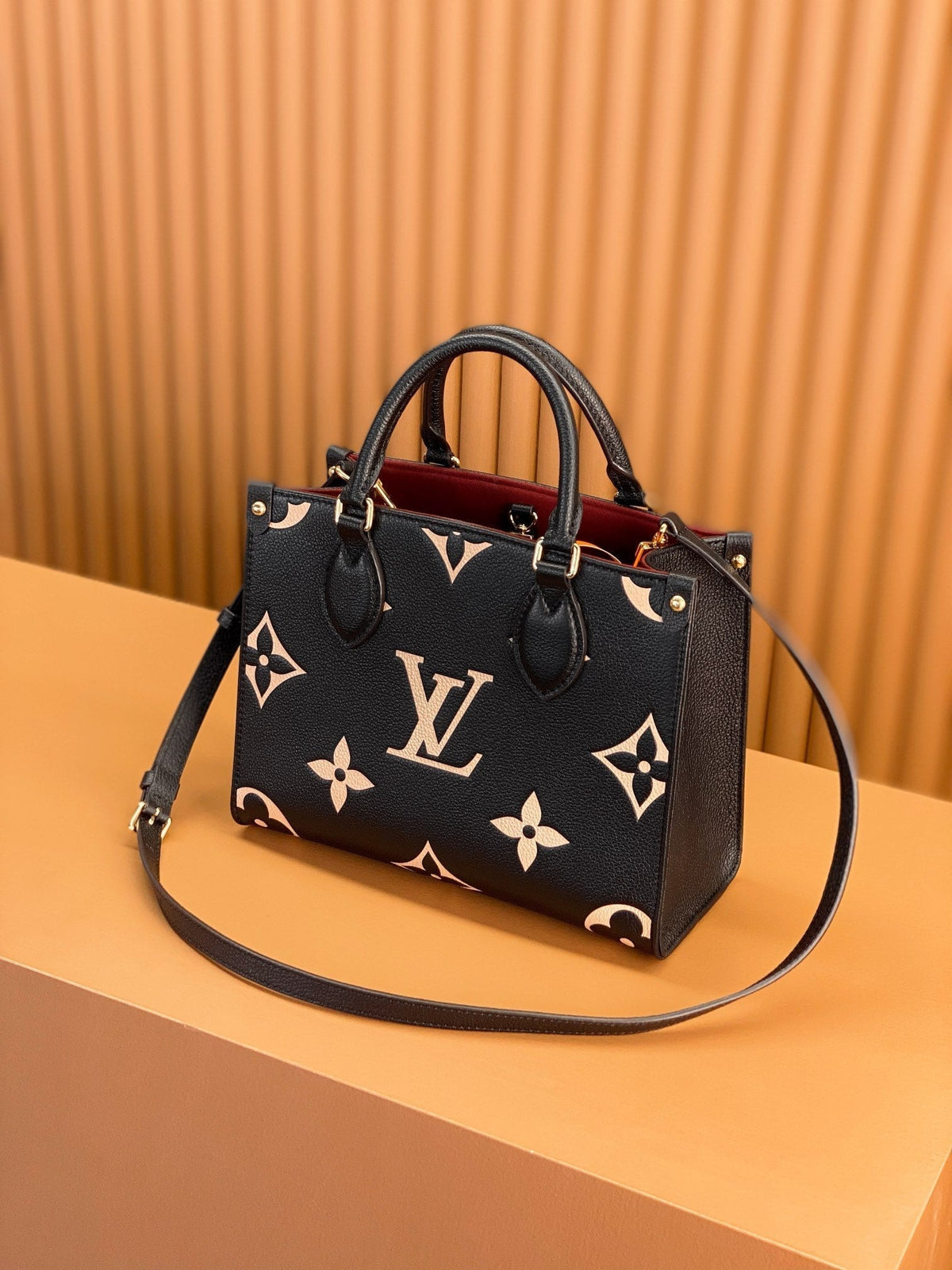 Onthego Tote 25 in Black and Cream Monogram Empreinte