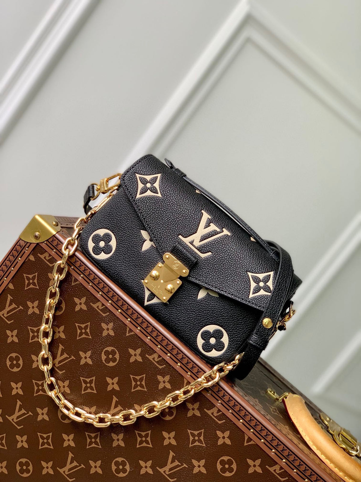 Pochette Métis East West 21 in Black and Beige Monogram Empreinte Calfskin Embossed Logo