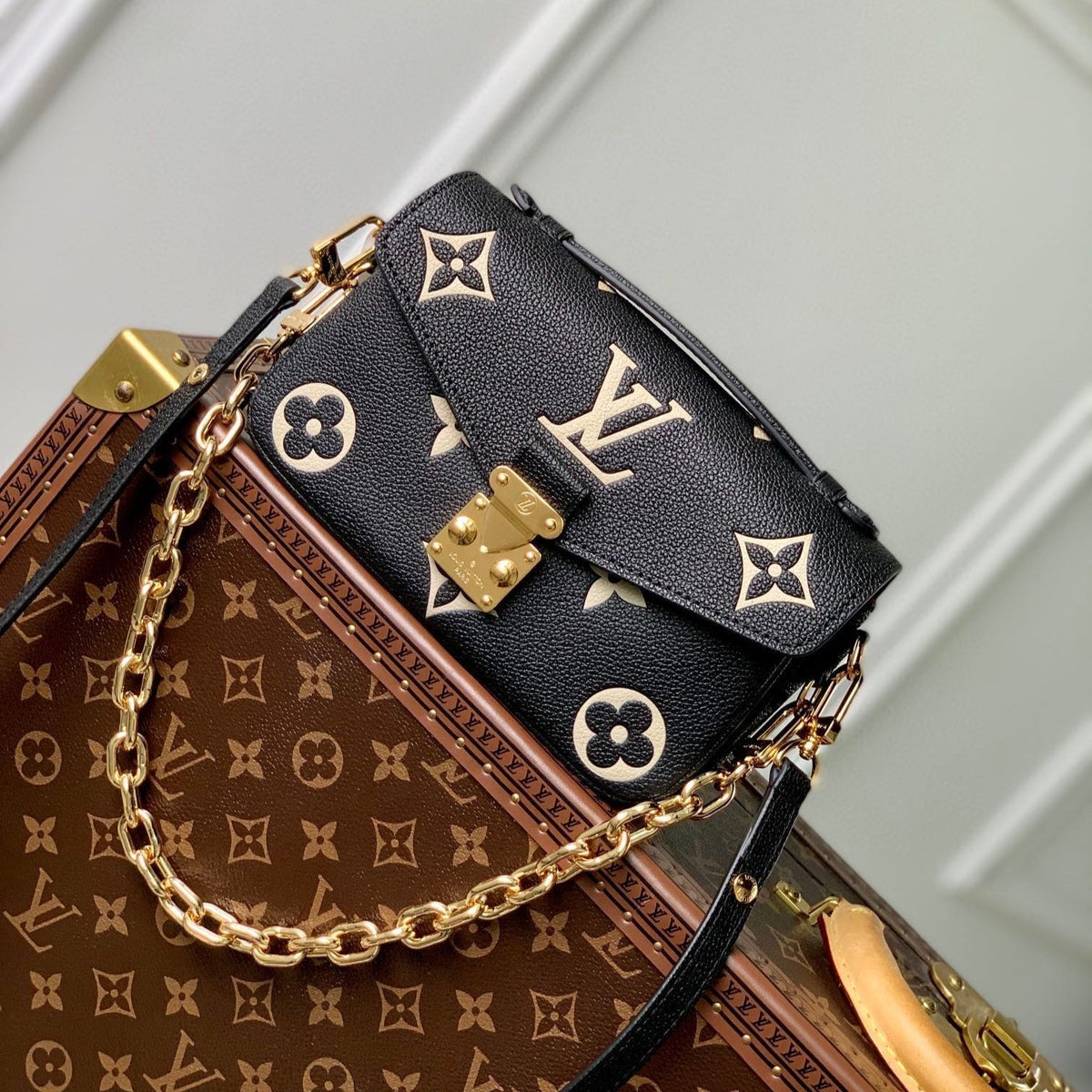 Pochette Métis East West 21 in Black and Beige Monogram Empreinte Calfskin Embossed Logo