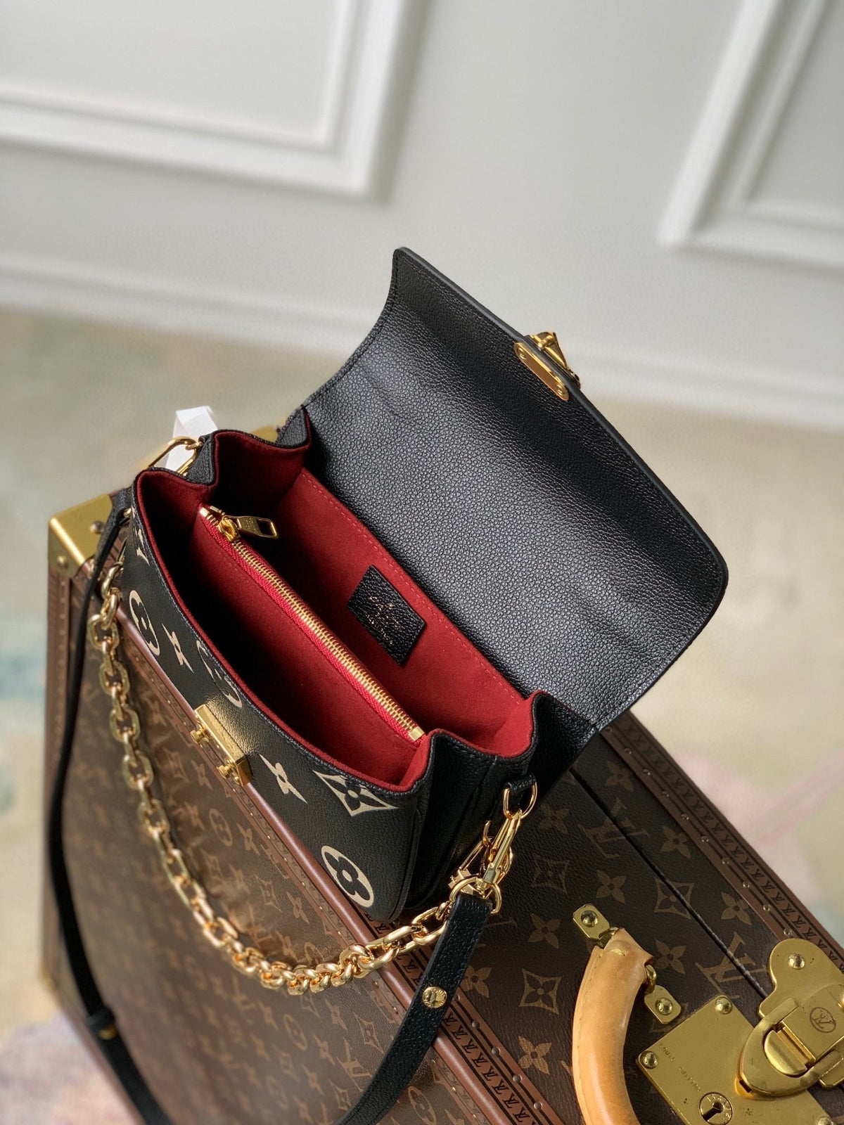 Pochette Métis East West 21 in Black and Beige Monogram Empreinte Calfskin Embossed Logo