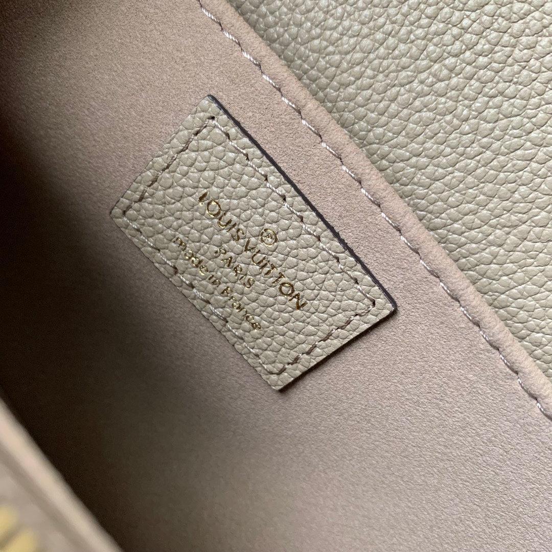 Pochette Métis East West 21 in Beige Monogram Empreinte Calfskin Embossed Logo