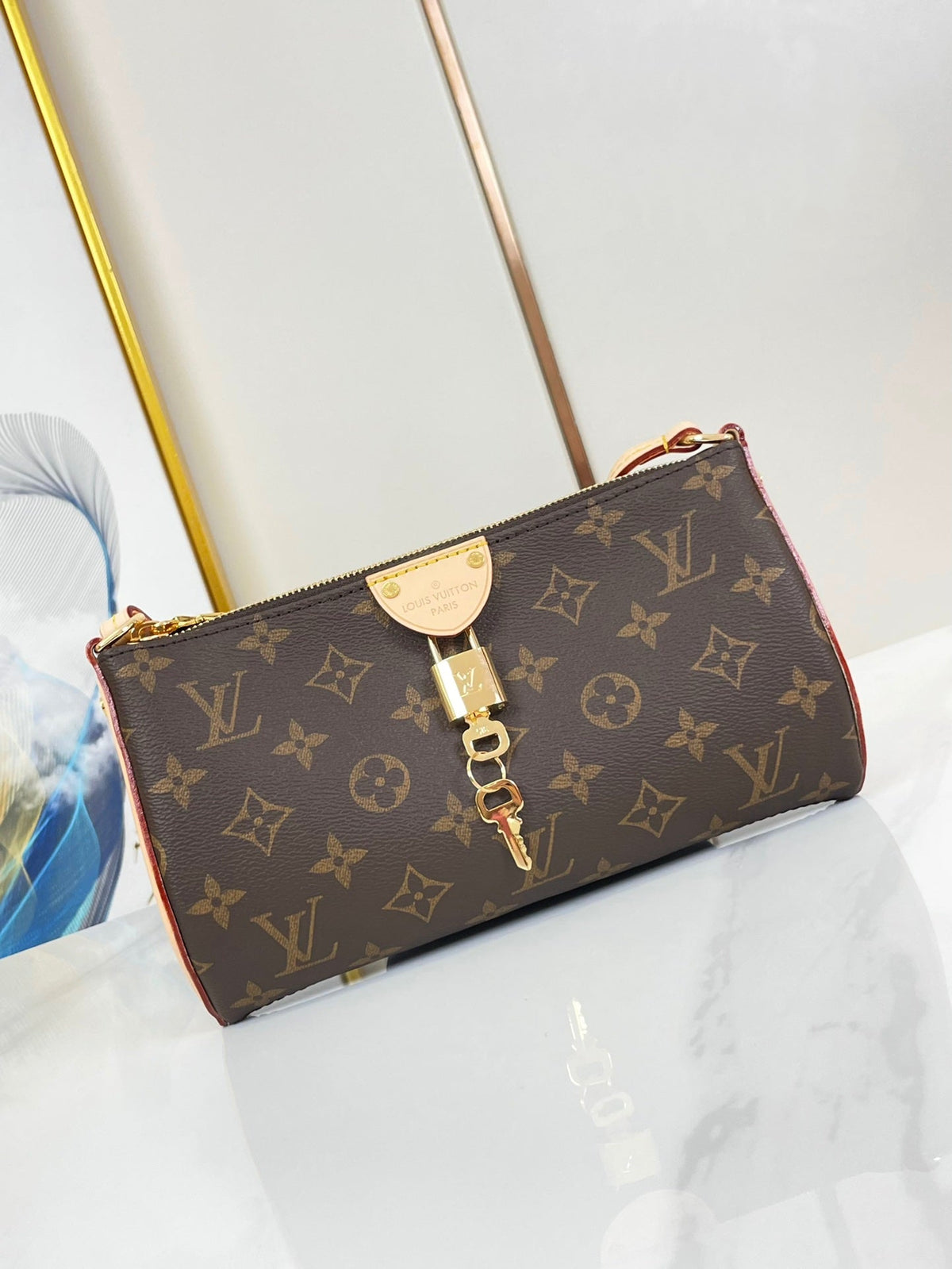 Pochette Tirette 22 in Brown Monogram Canvas Gold Buckle