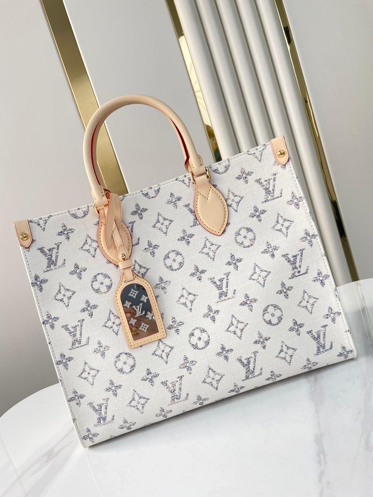 Onthego MM 35 in White Monogram Jacquard Fabric