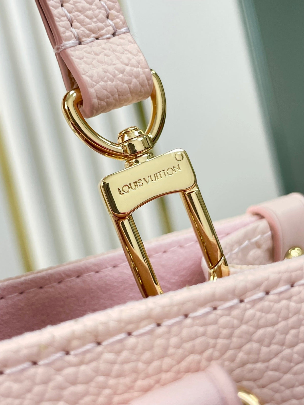 Onthego PM 25 in Opale Pink Monogram Empreinte Leather