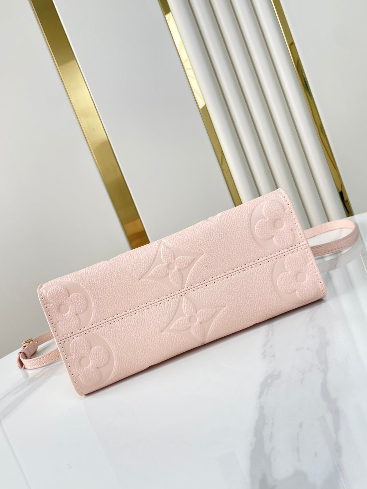 Onthego PM 25 in Opale Pink Monogram Empreinte Leather