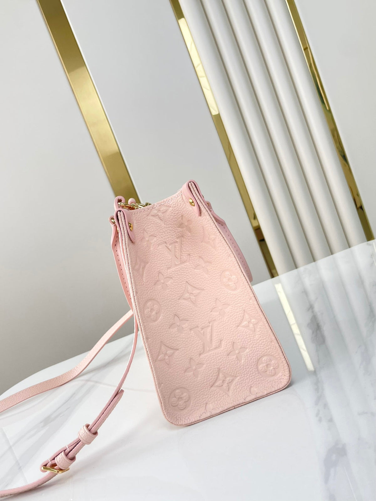 Onthego PM 25 in Opale Pink Monogram Empreinte Leather