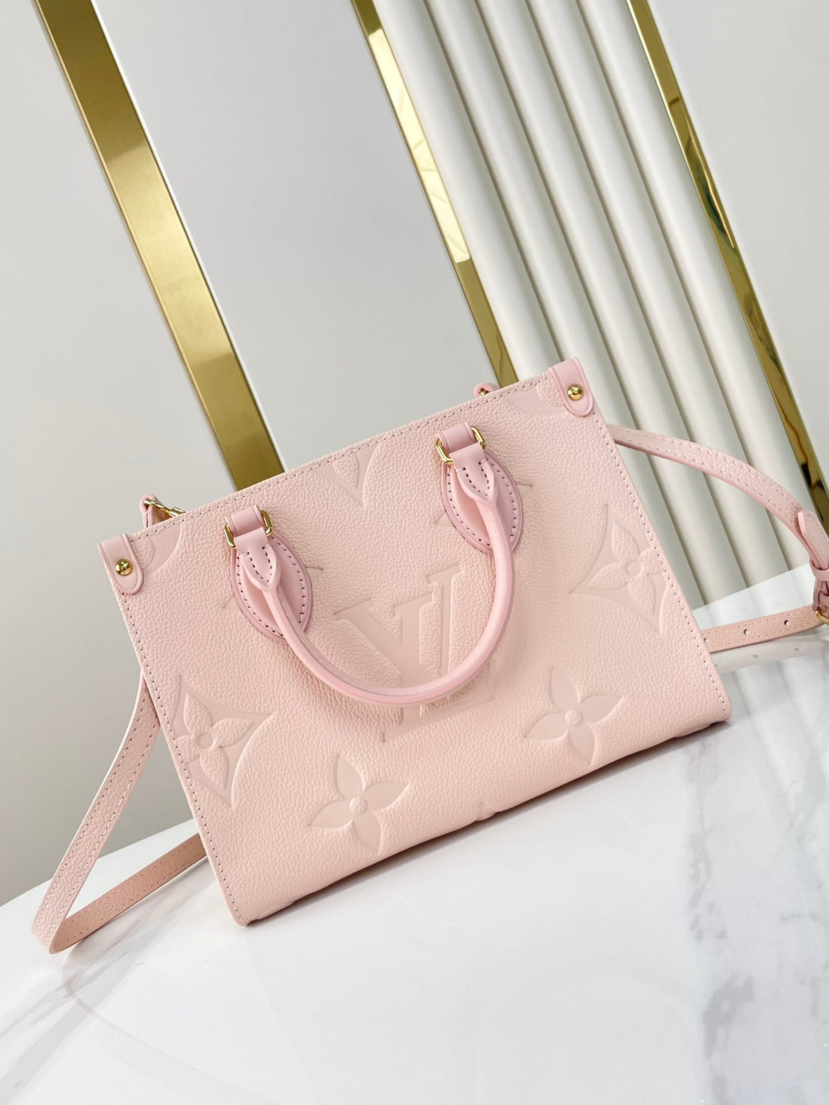 Onthego PM 25 in Opale Pink Monogram Empreinte Leather