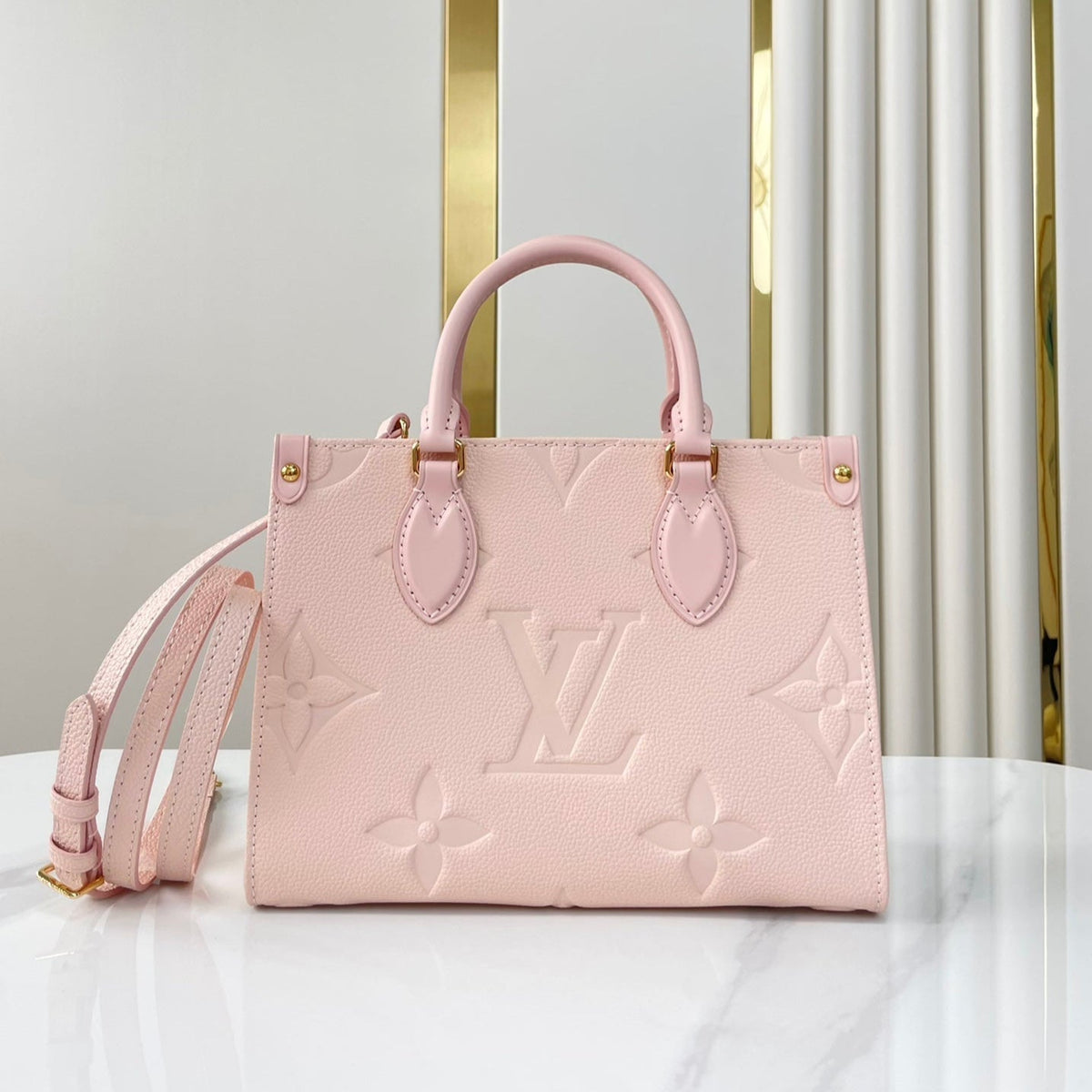 Onthego PM 25 in Opale Pink Monogram Empreinte Leather