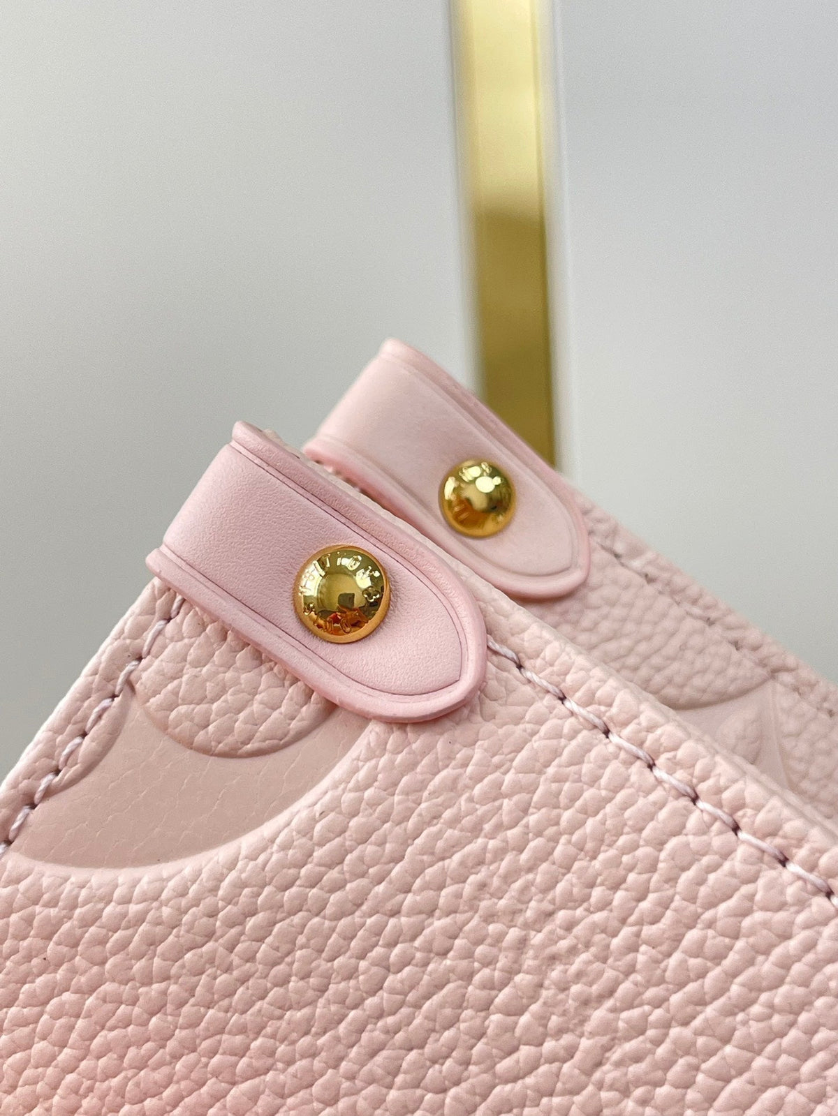 Onthego PM 25 in Opale Pink Monogram Empreinte Leather