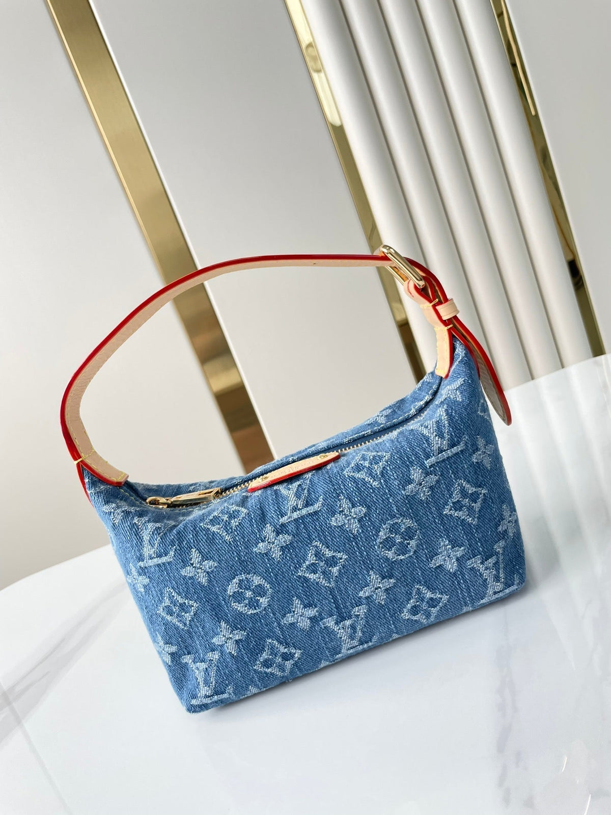 Hills Pochette 18 in Blue Monogram Denim