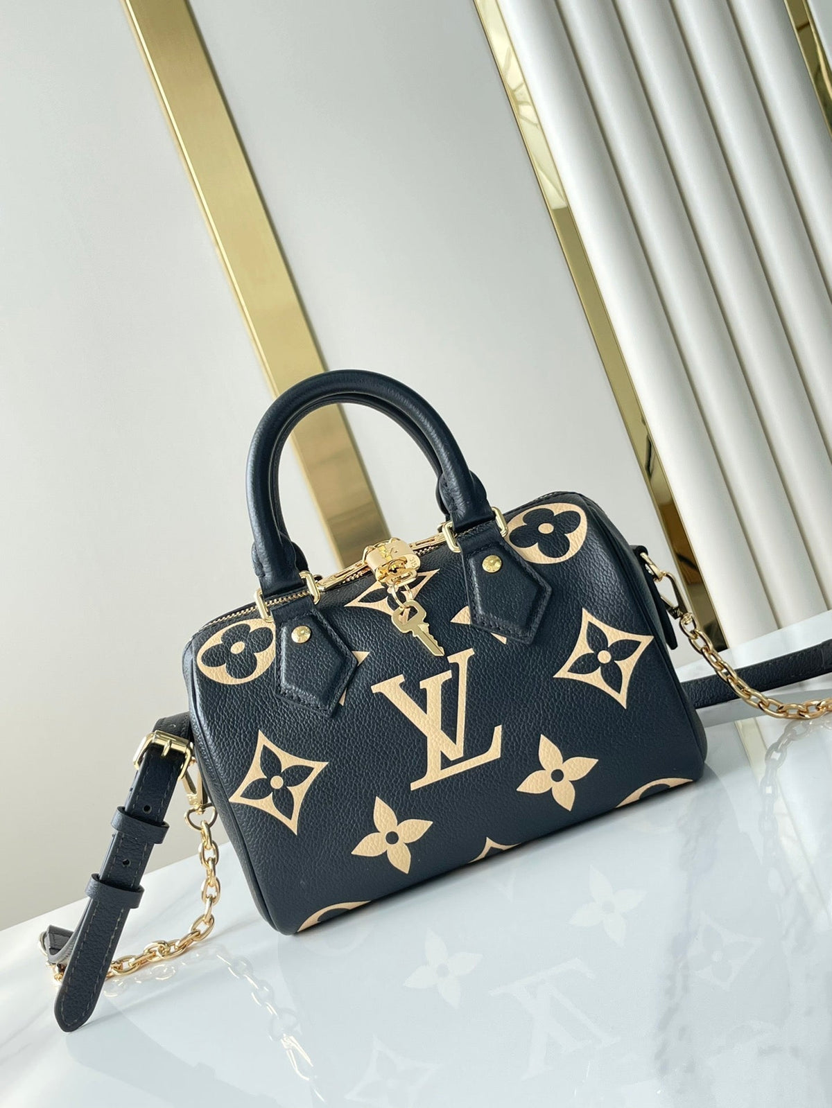 Speedy Bandoulière 20 in Black Cream Monogram Empreinte Leather Gold Hardware