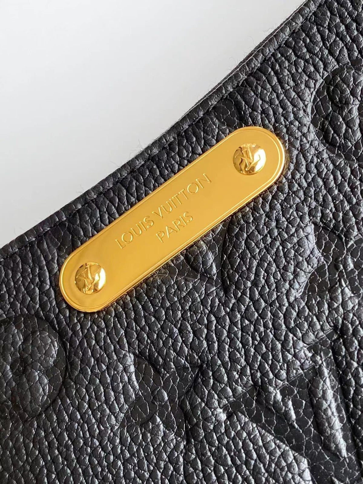 Liv Pochette 24 in Black Monogram Empreinte Leather Gold Hardware