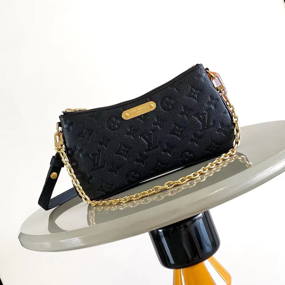 Liv Pochette 24 in Black Monogram Empreinte Leather Gold Hardware