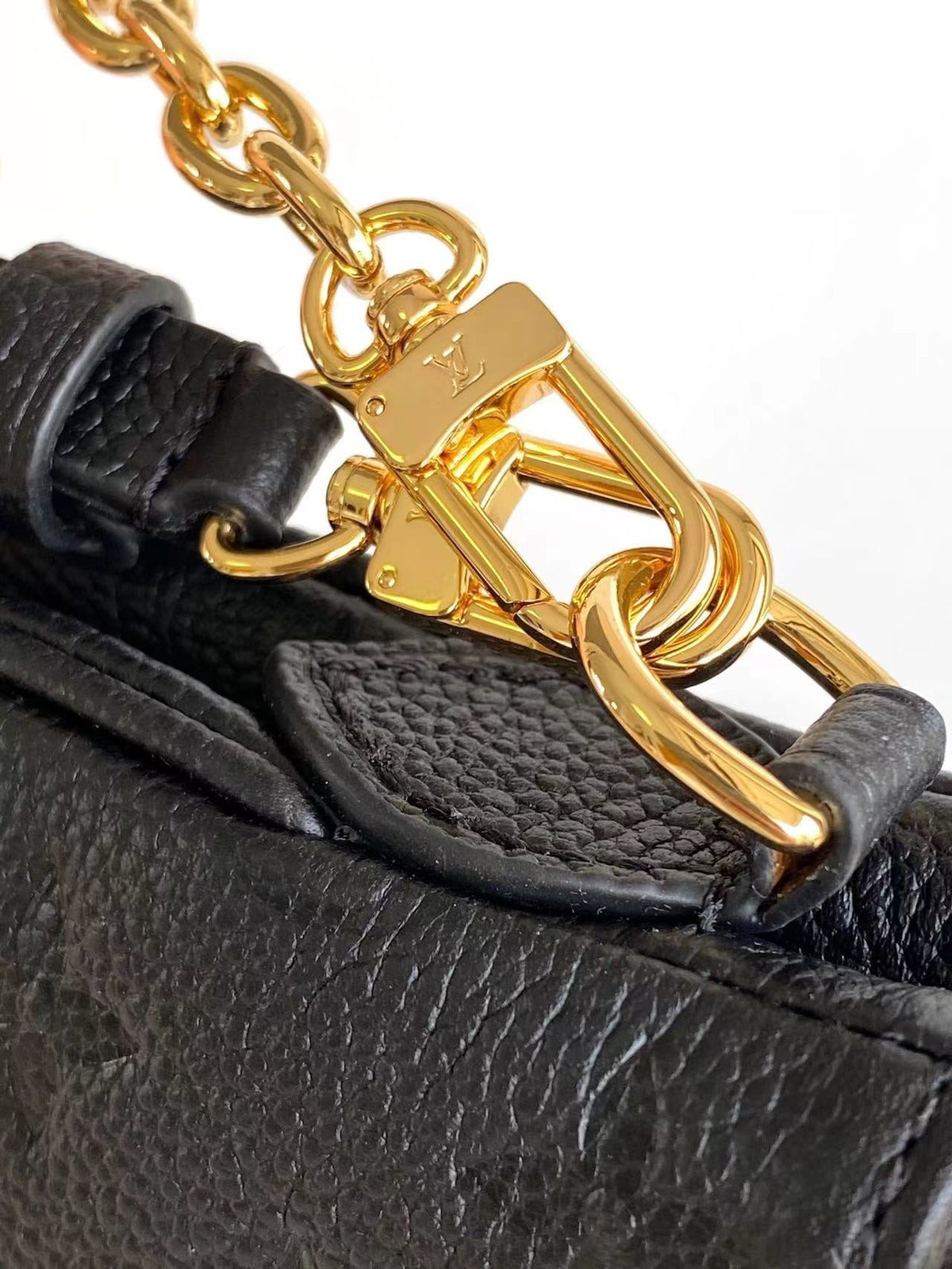 Liv Pochette 24 in Black Monogram Empreinte Leather Gold Hardware
