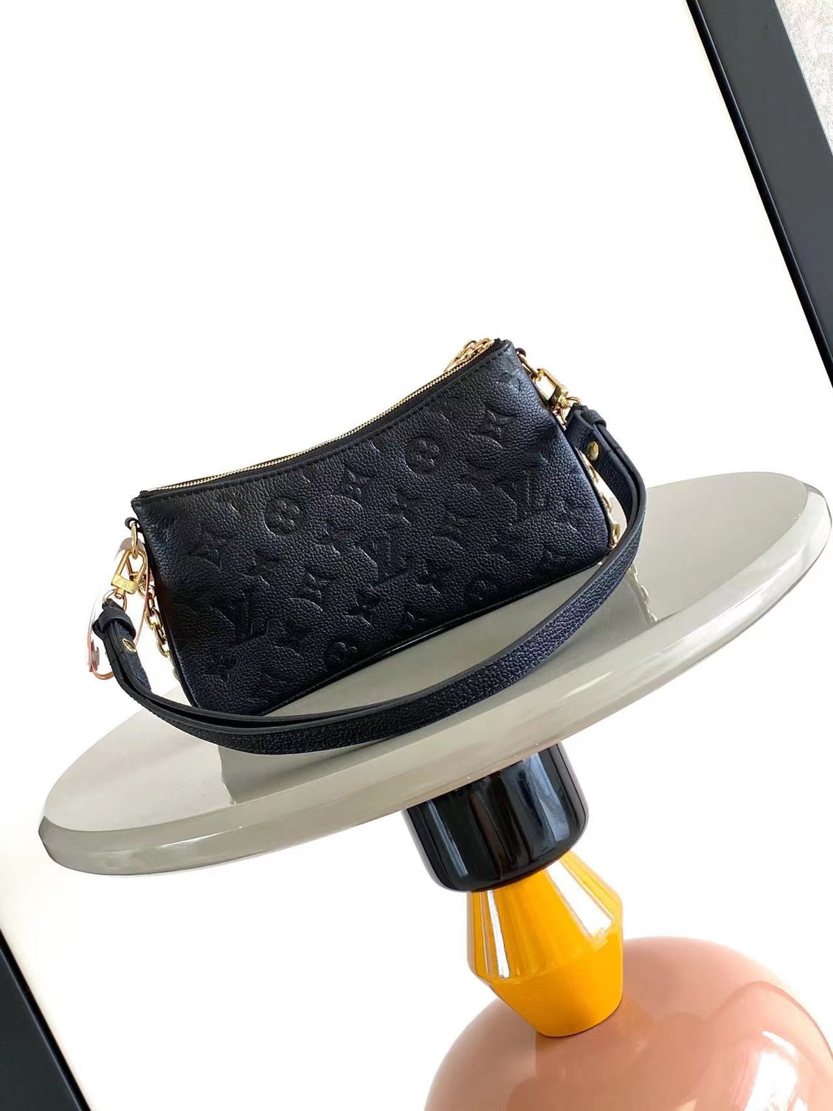 Liv Pochette 24 in Black Monogram Empreinte Leather Gold Hardware