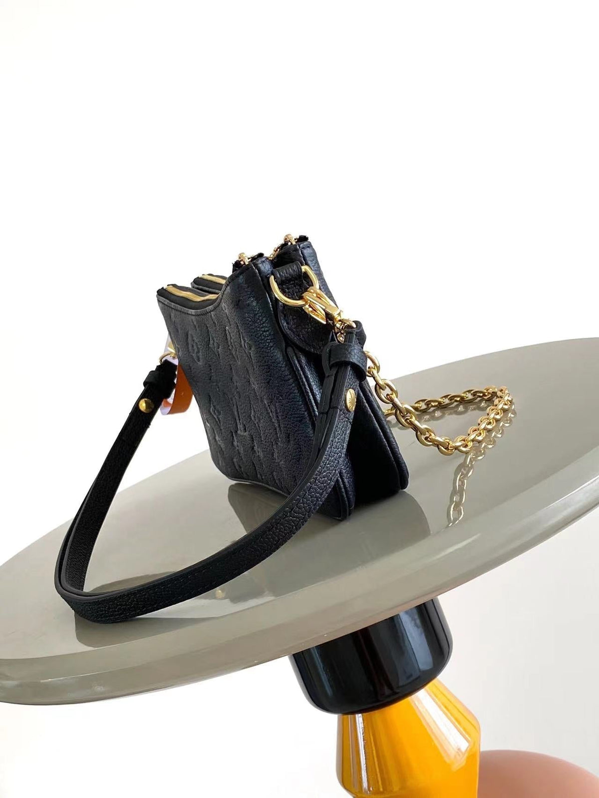 Liv Pochette 24 in Black Monogram Empreinte Leather Gold Hardware