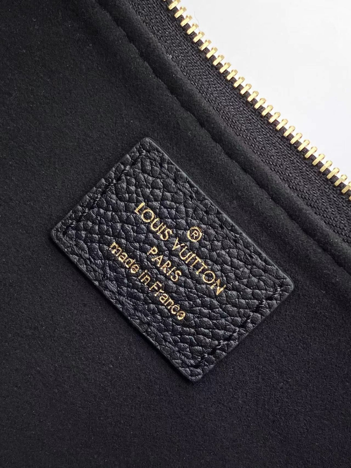 Liv Pochette 24 in Black Monogram Empreinte Leather Gold Hardware