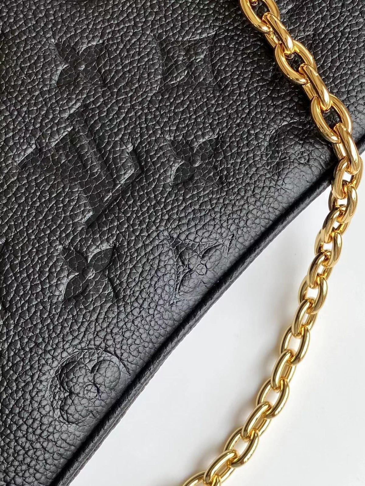 Liv Pochette 24 in Black Monogram Empreinte Leather Gold Hardware