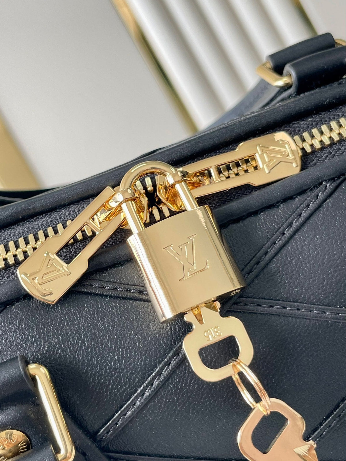 Speedy Bandoulière 25 with Criss Cross Pattern in Black Lambskin