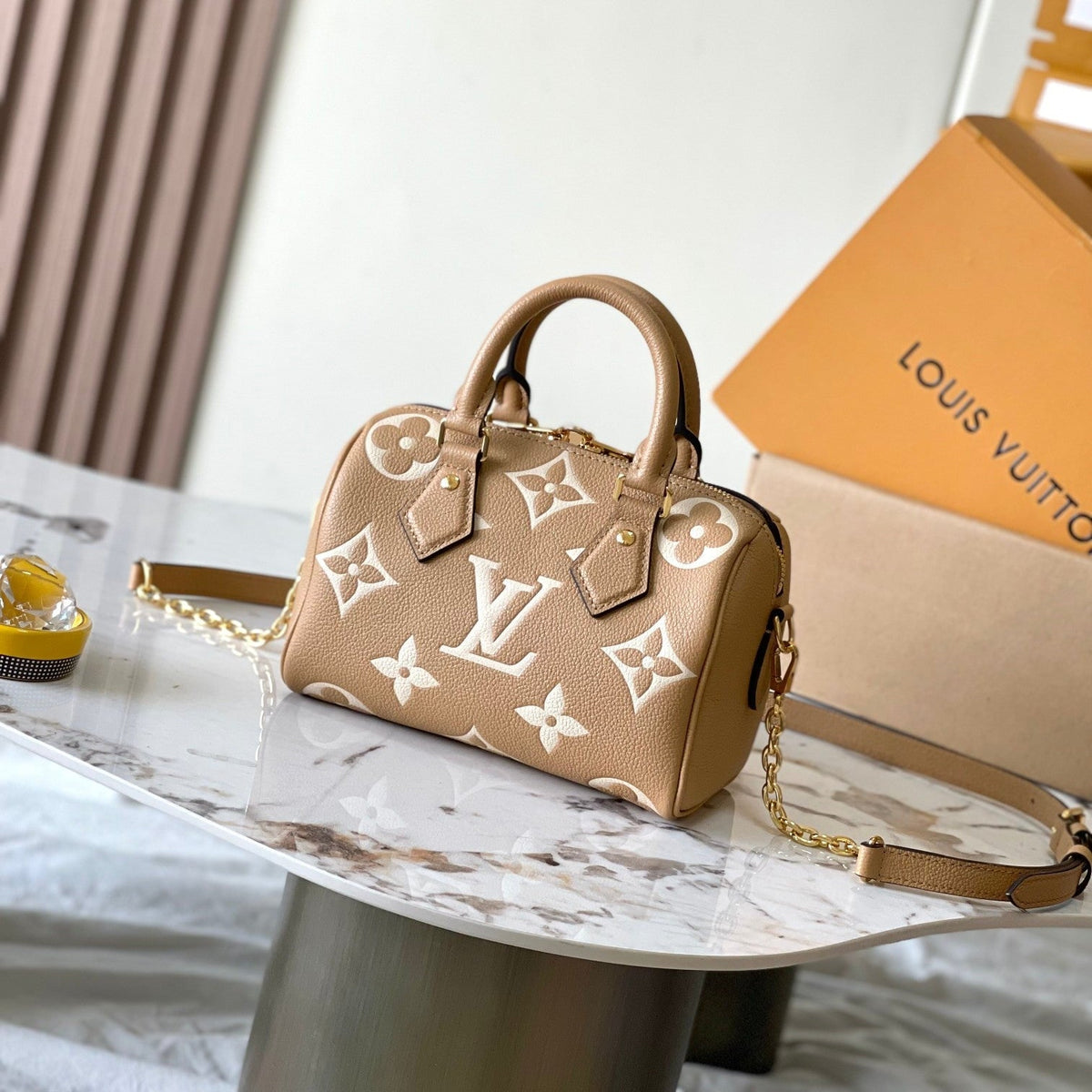 Speedy Bandoulière 20 in Milk Tea Monogram Empreinte Leather
