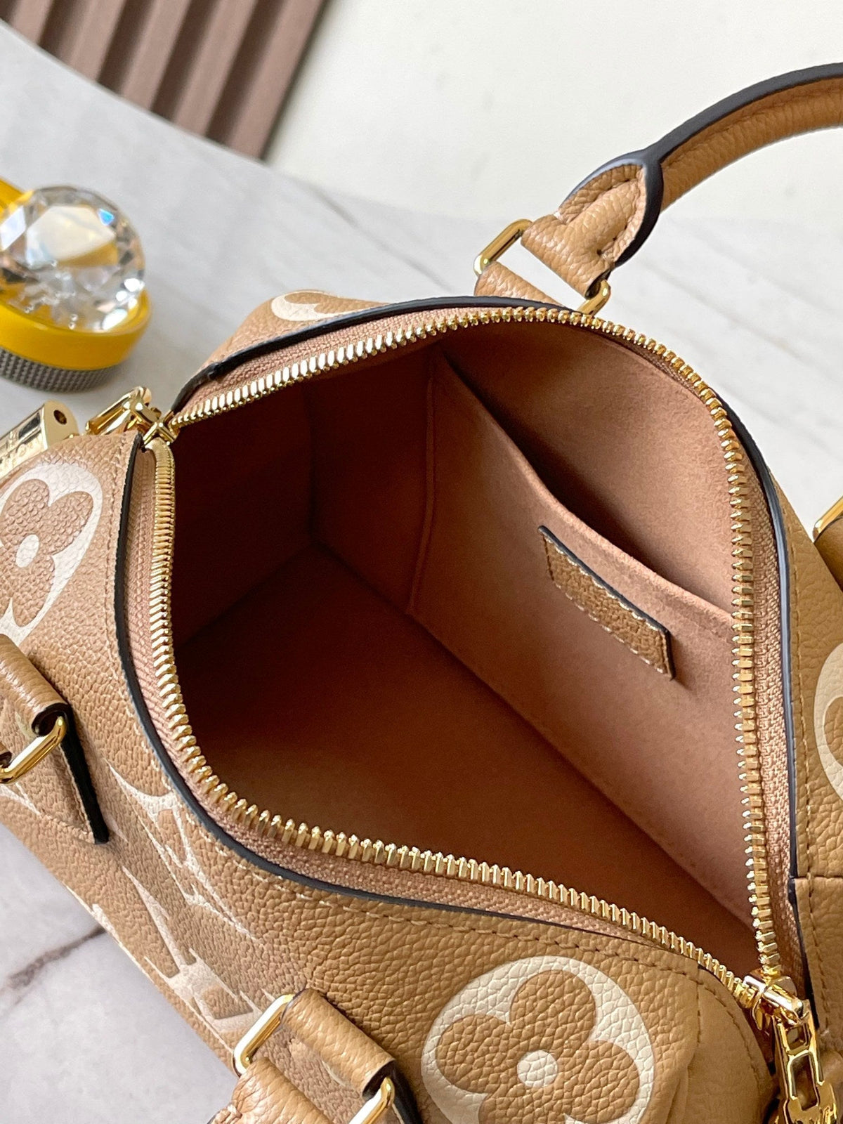 Speedy Bandoulière 20 in Milk Tea Monogram Empreinte Leather