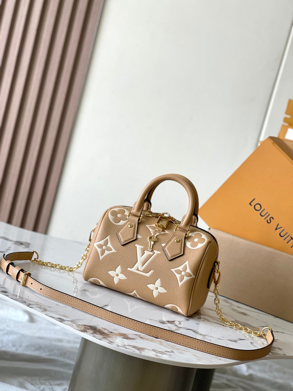 Speedy Bandoulière 20 in Milk Tea Monogram Empreinte Leather