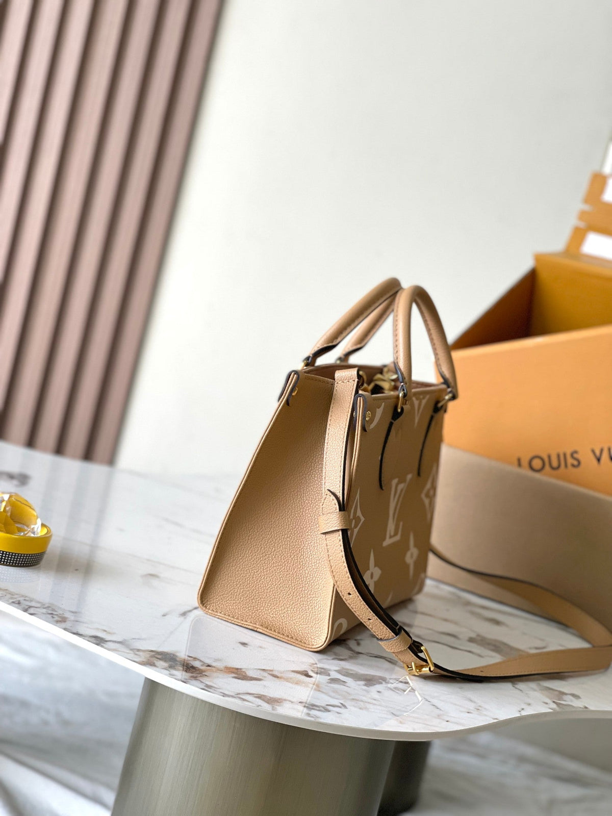 Onthego PM 25 in Milk Tea Monogram Impreinte Leather