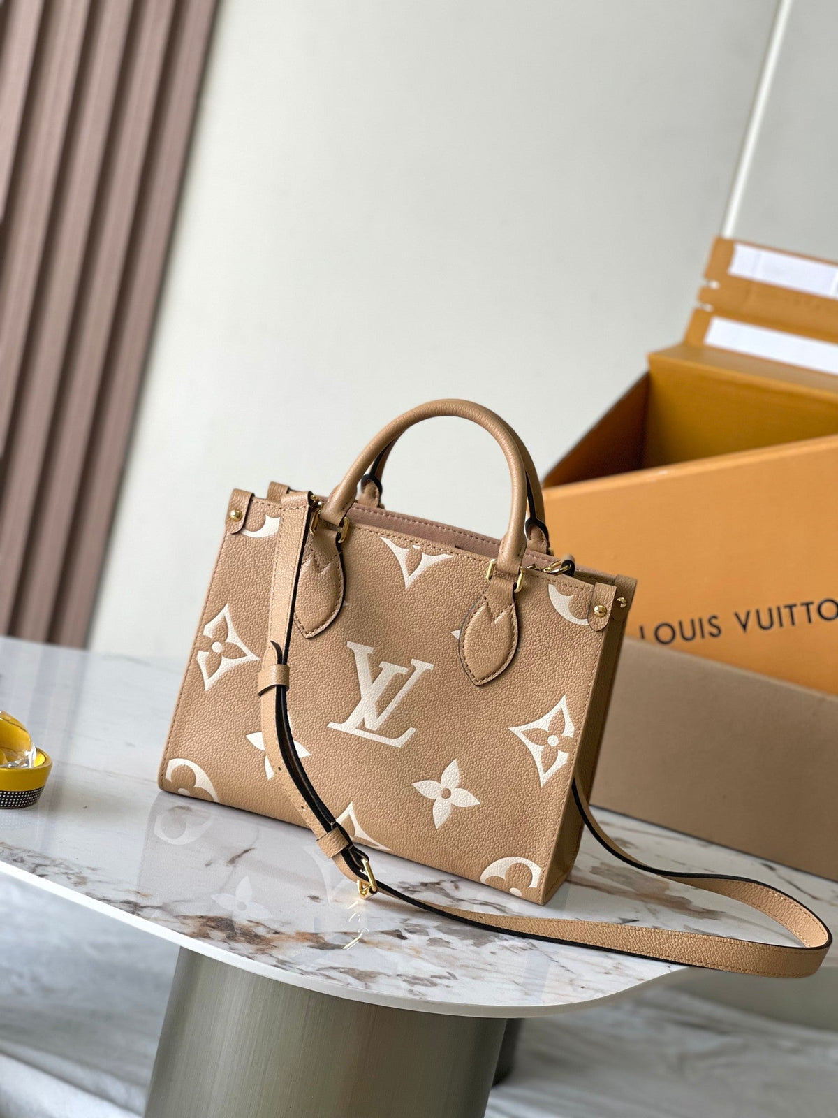 Onthego PM 25 in Milk Tea Monogram Impreinte Leather