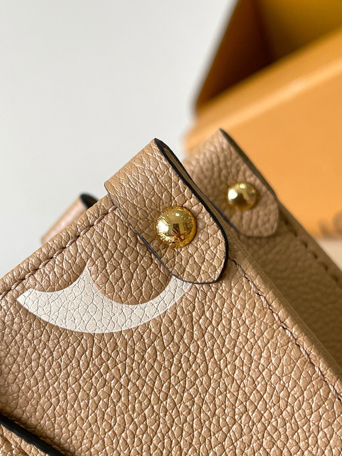 Onthego PM 25 in Milk Tea Monogram Impreinte Leather