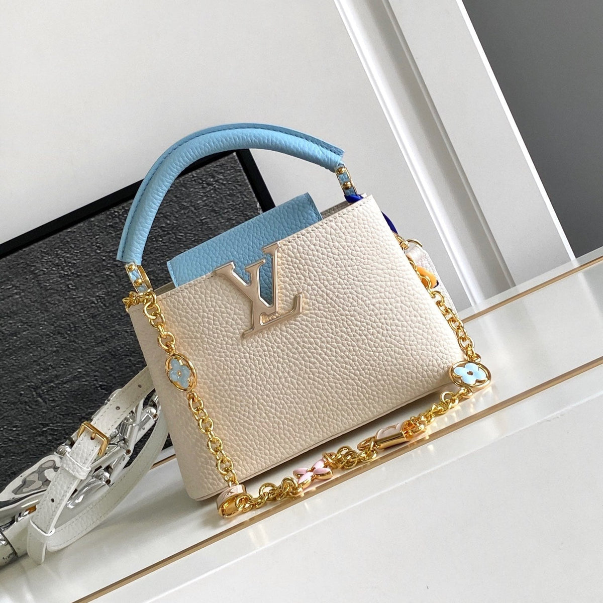 Capucines Mini 21 in Pearl White Mix Sky Blue Taurillon Gold Hardware