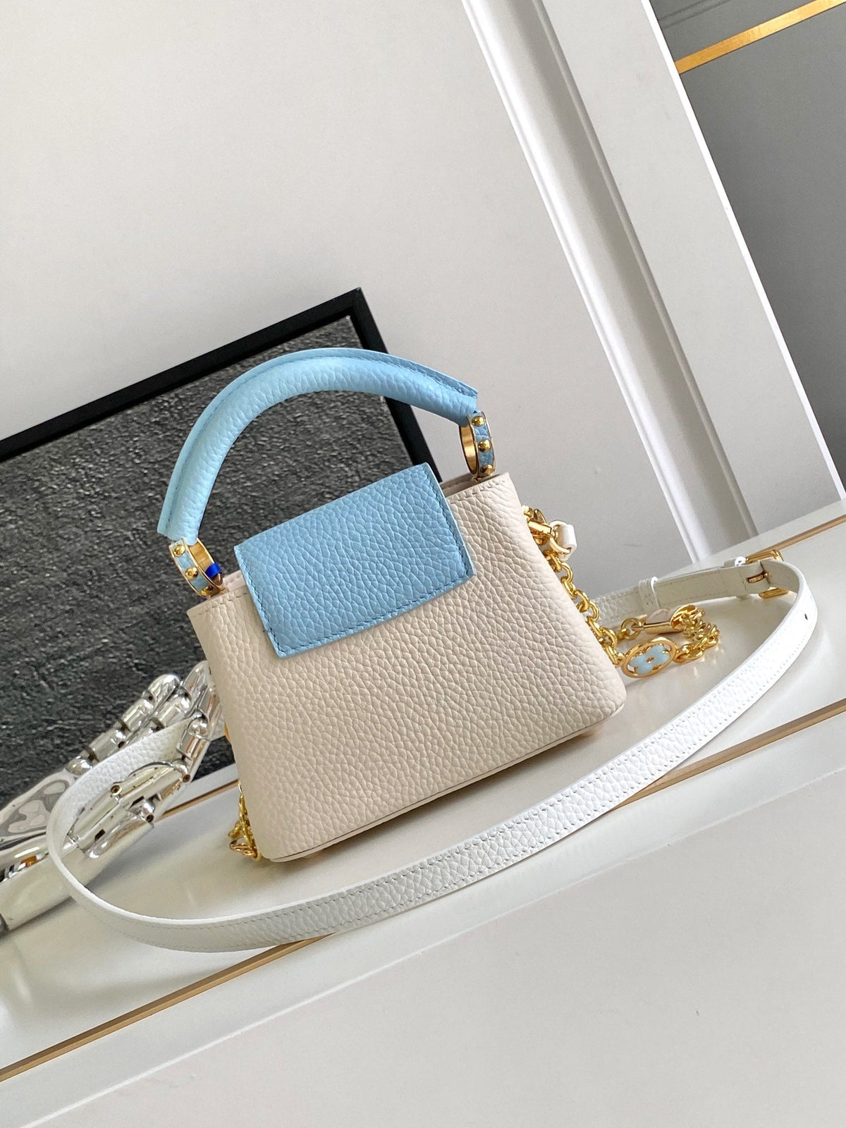 Capucines Nano 16 in Pearl White Mix Sky Blue Taurillon Gold Hardware
