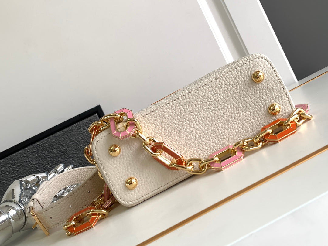 Capucines Mini 21 in Pearl White Taurillon Gold Hardware