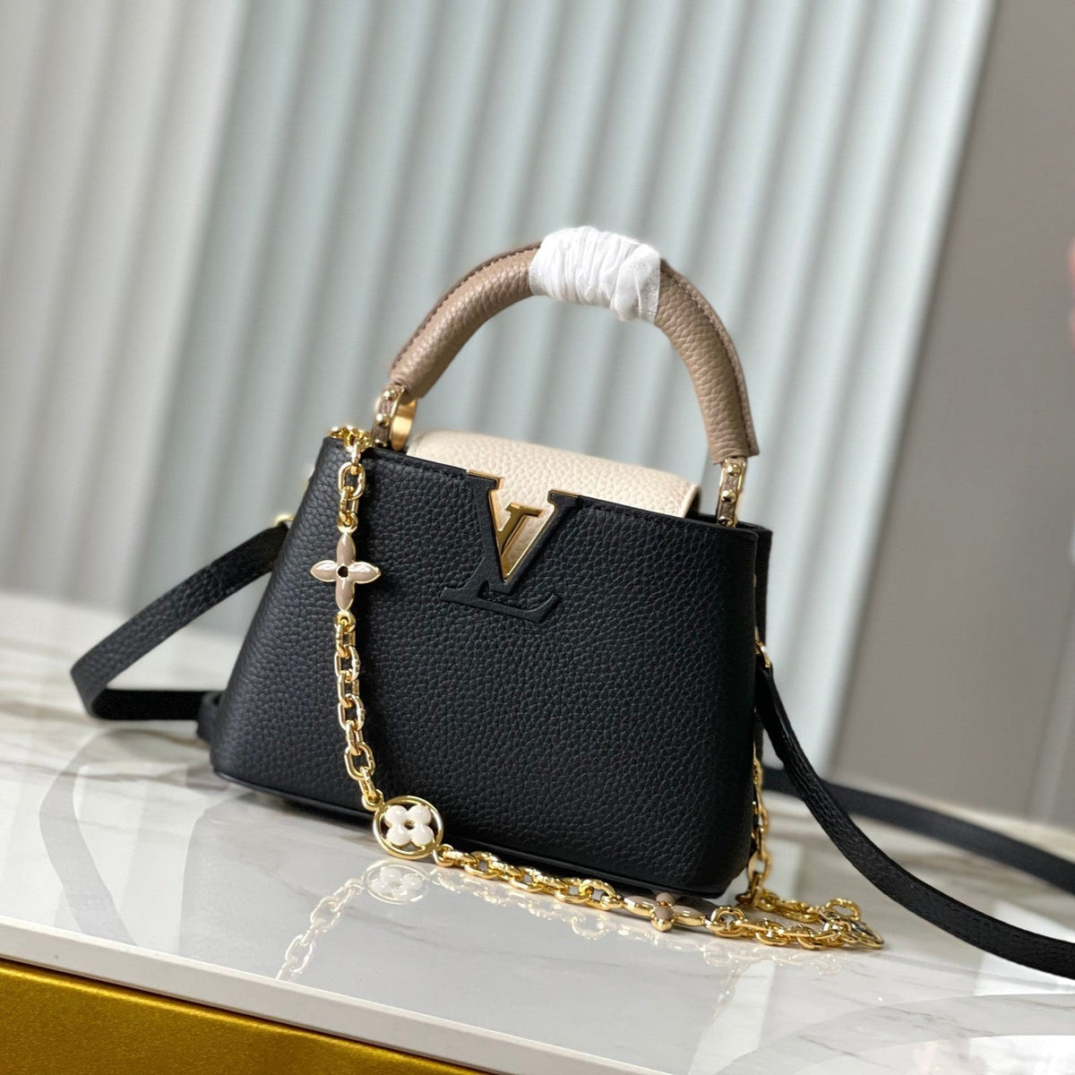 Capucines Mini 21 in Black Mix White Taurillon Gold Hardware