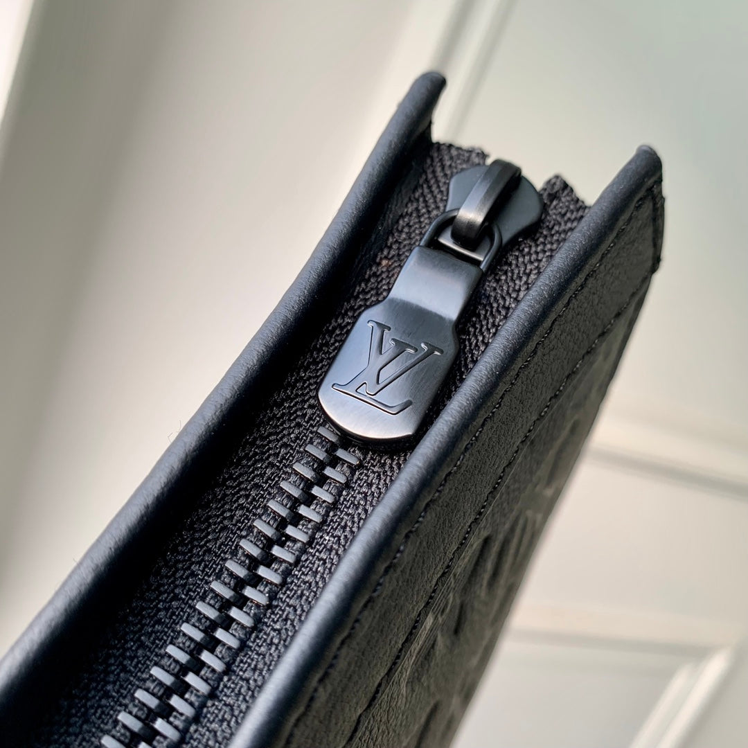 Pochette Voyage 22 in Black Monogram Shadow Calfskin