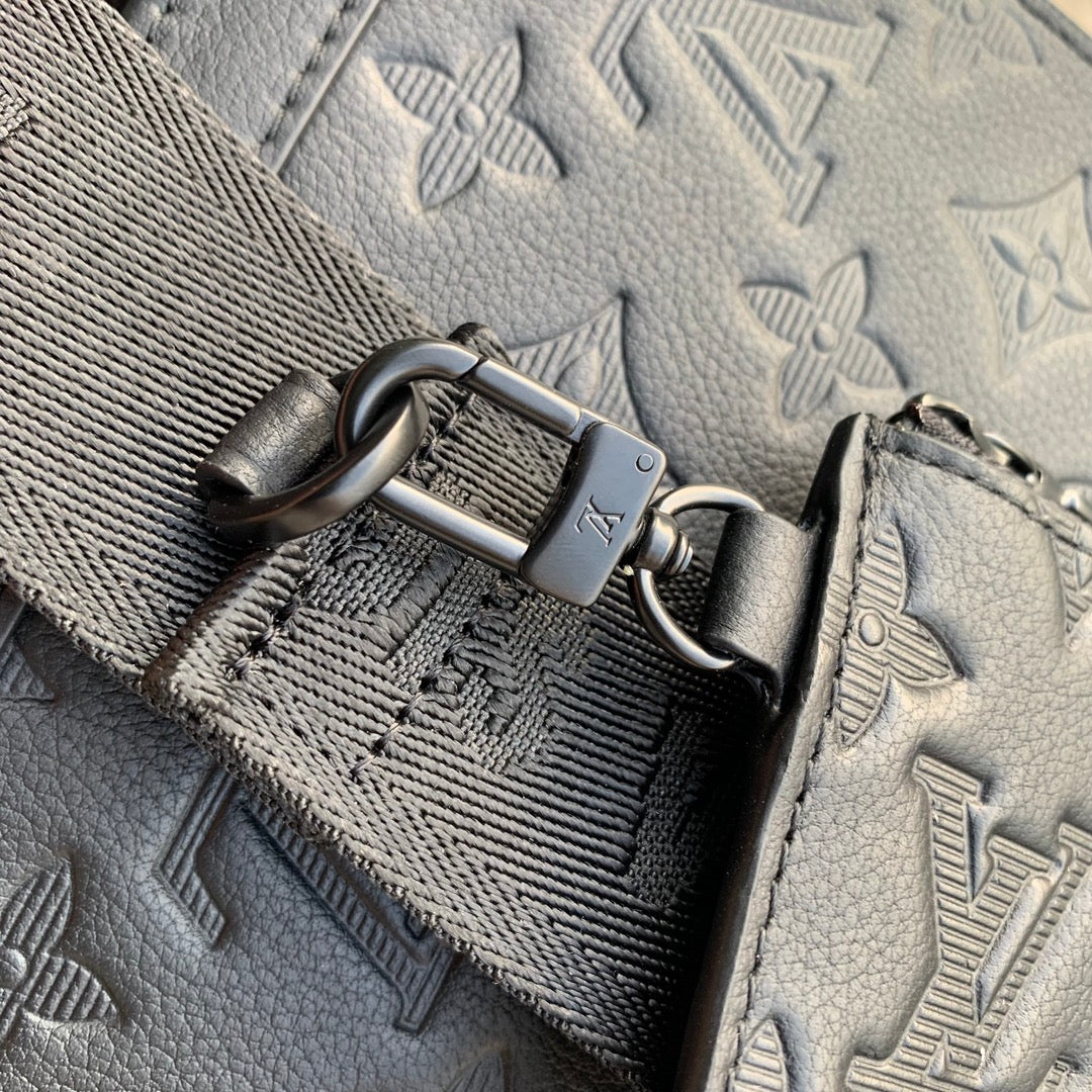 Pochette Voyage 22 in Black Monogram Shadow Calfskin