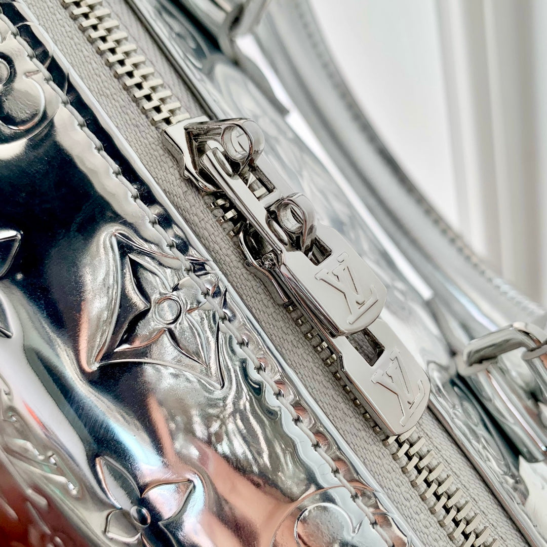 Speedy Bandoulière 20 in Silver Monogram Embossed Calfskin