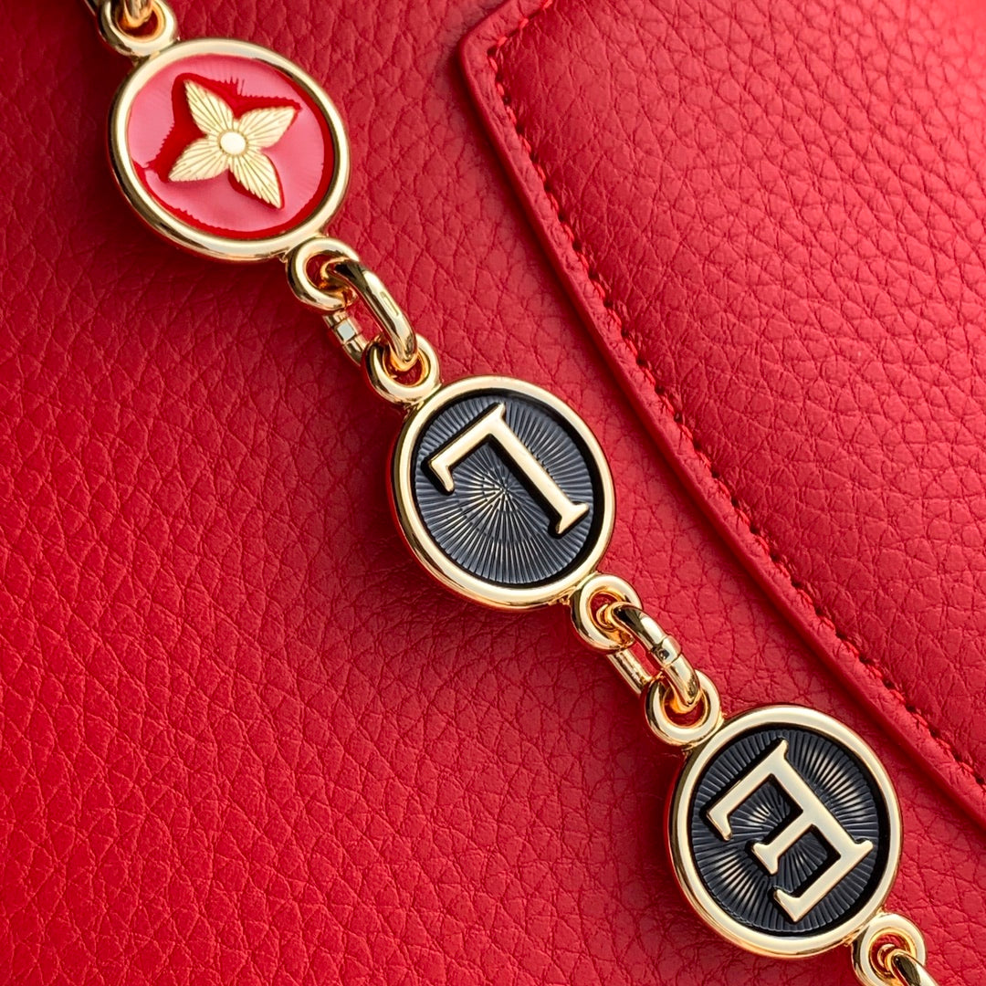 Capucines Mini 23 in Red Taurillon Gold Hardware