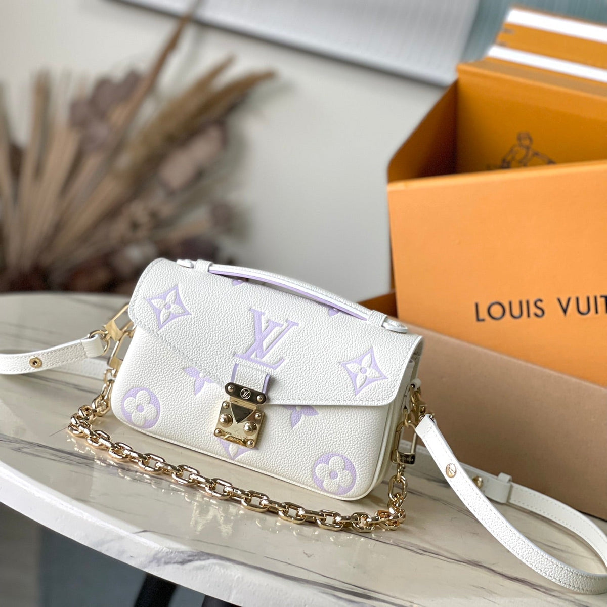 Pochette Metis East West 21 in White Purple Monogram Empreinte Leather
