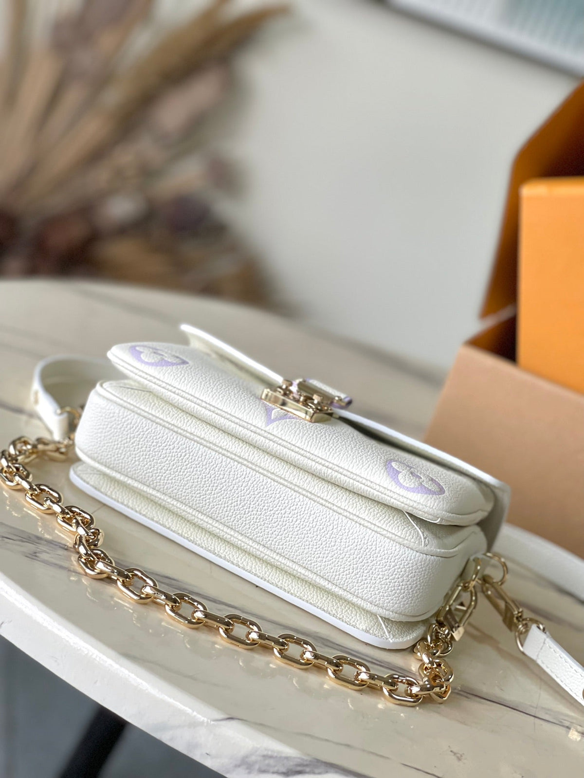Pochette Metis East West 21 in White Purple Monogram Empreinte Leather