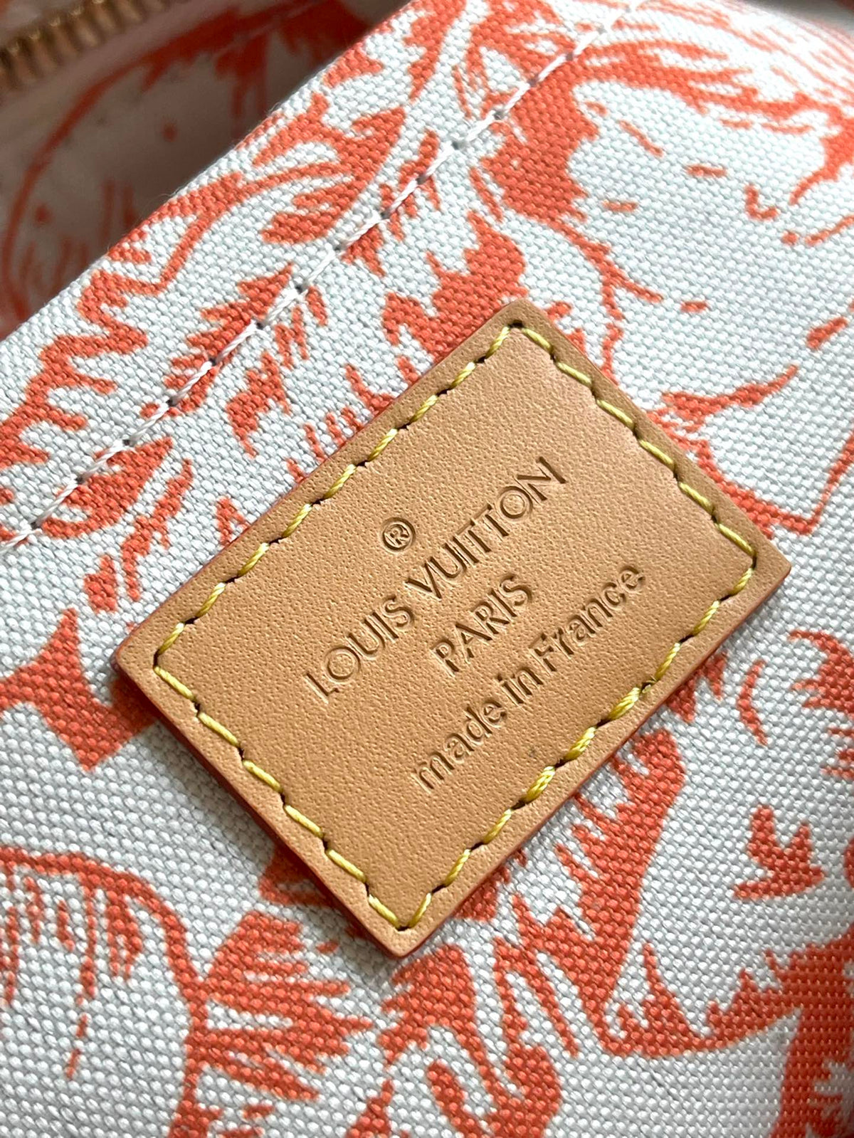 Onthego East West 25 in Coral Monogram Tiles Canvas