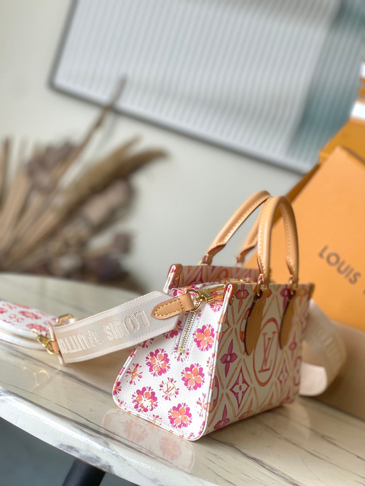 Onthego East West 25 in Coral Monogram Tiles Canvas