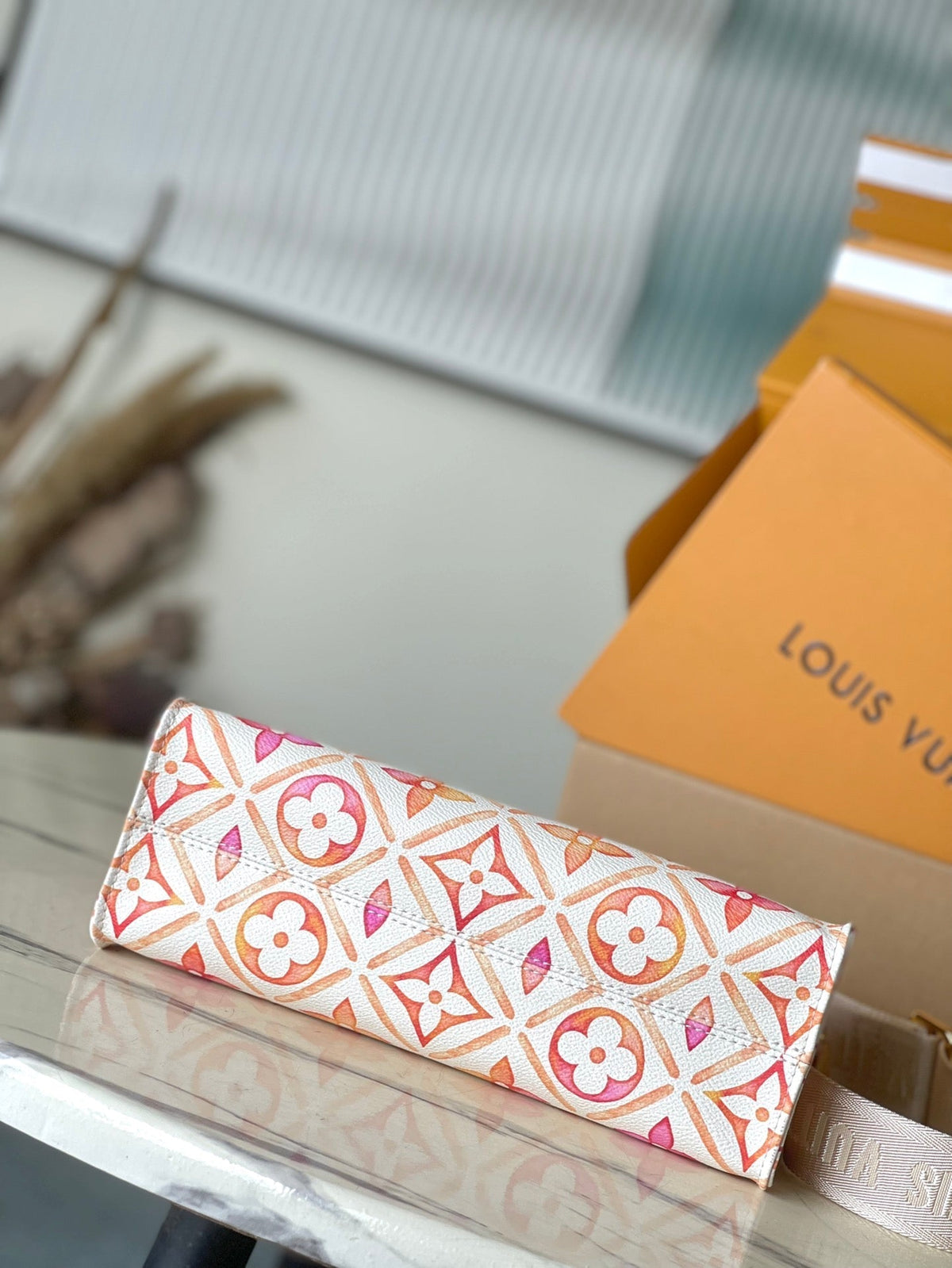 Onthego East West 25 in Coral Monogram Tiles Canvas